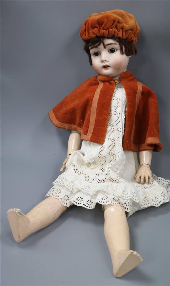 A bisque headed doll by Max Handwerk Germany length 70cm